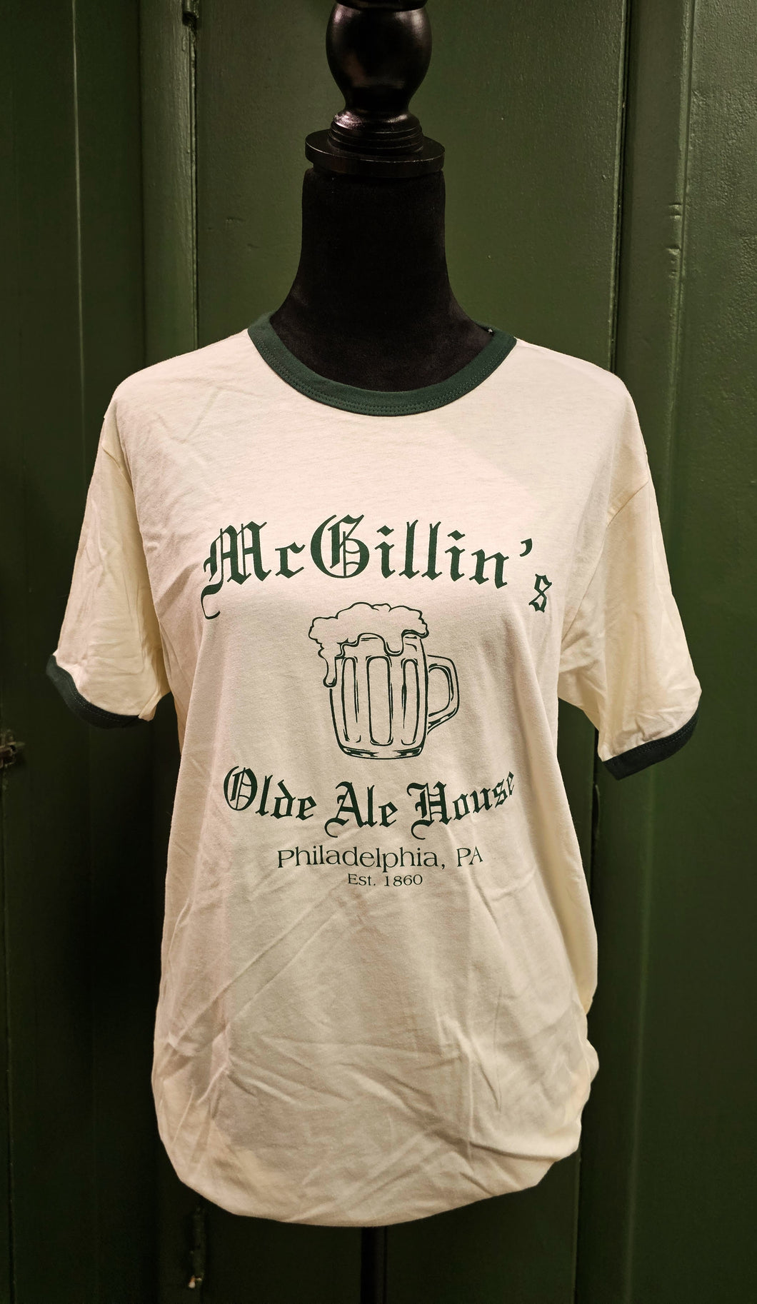 Cream colored shirt with McGillin's Mug  with Dark Green Ringer