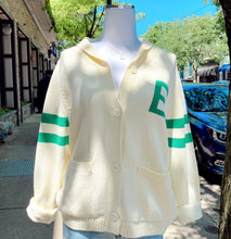 White cardigan with green stripes 