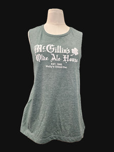 Faded green tank top with white text on a mannequin against a black background