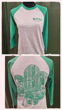 Gray and green baseball shirt with graphic design 